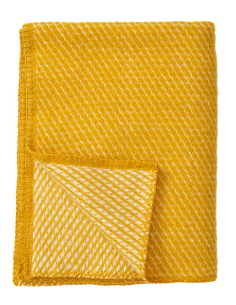Klippan - Velvet | ledikantdeken van lamswol Saffron 90x130 cm.