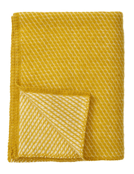 Klippan - Velvet Baby | wiegdeken van lamswol Saffron 65x90 cm.