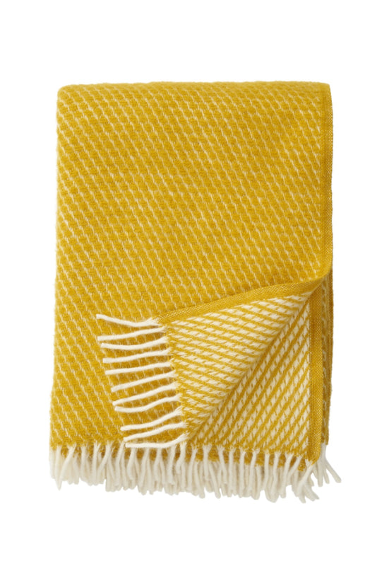 Klippan - Velvet | plaid van lamswol Saffron 180x200 cm.