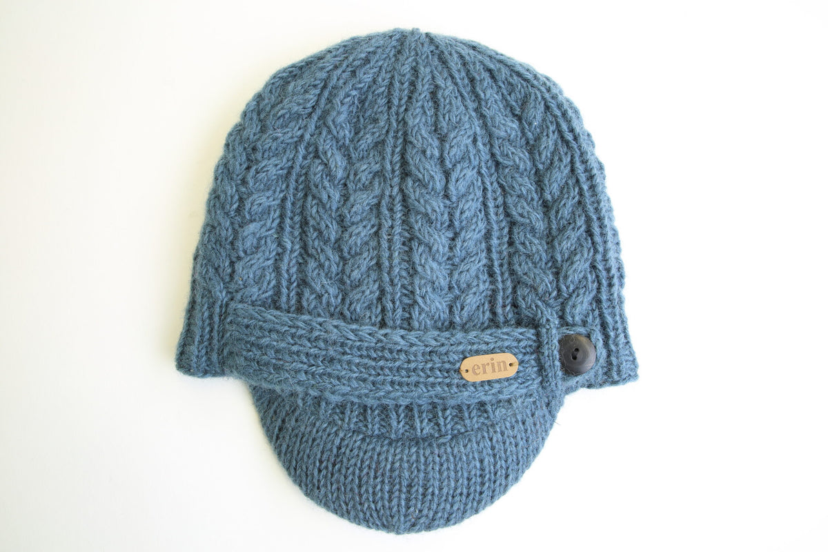 Erin Knitwear - Aran Cable Peak Hat | wollen muts met klep Denim blue